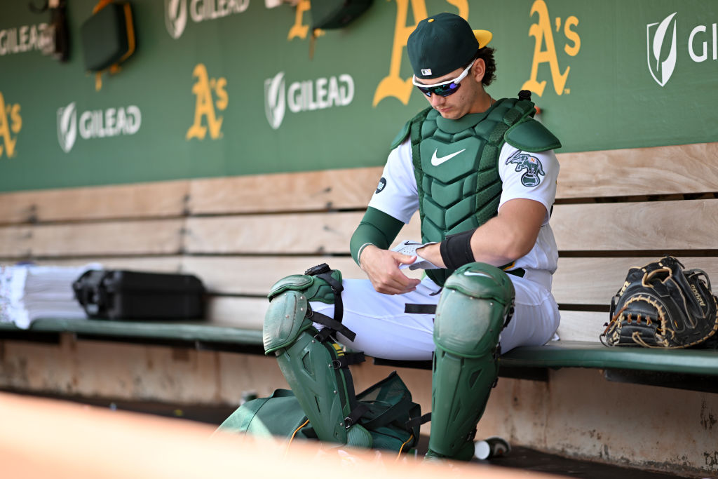 Tyler Soderstrom #37 of the Oakland Athletics sits in the dugout before a game against the Houston ...
