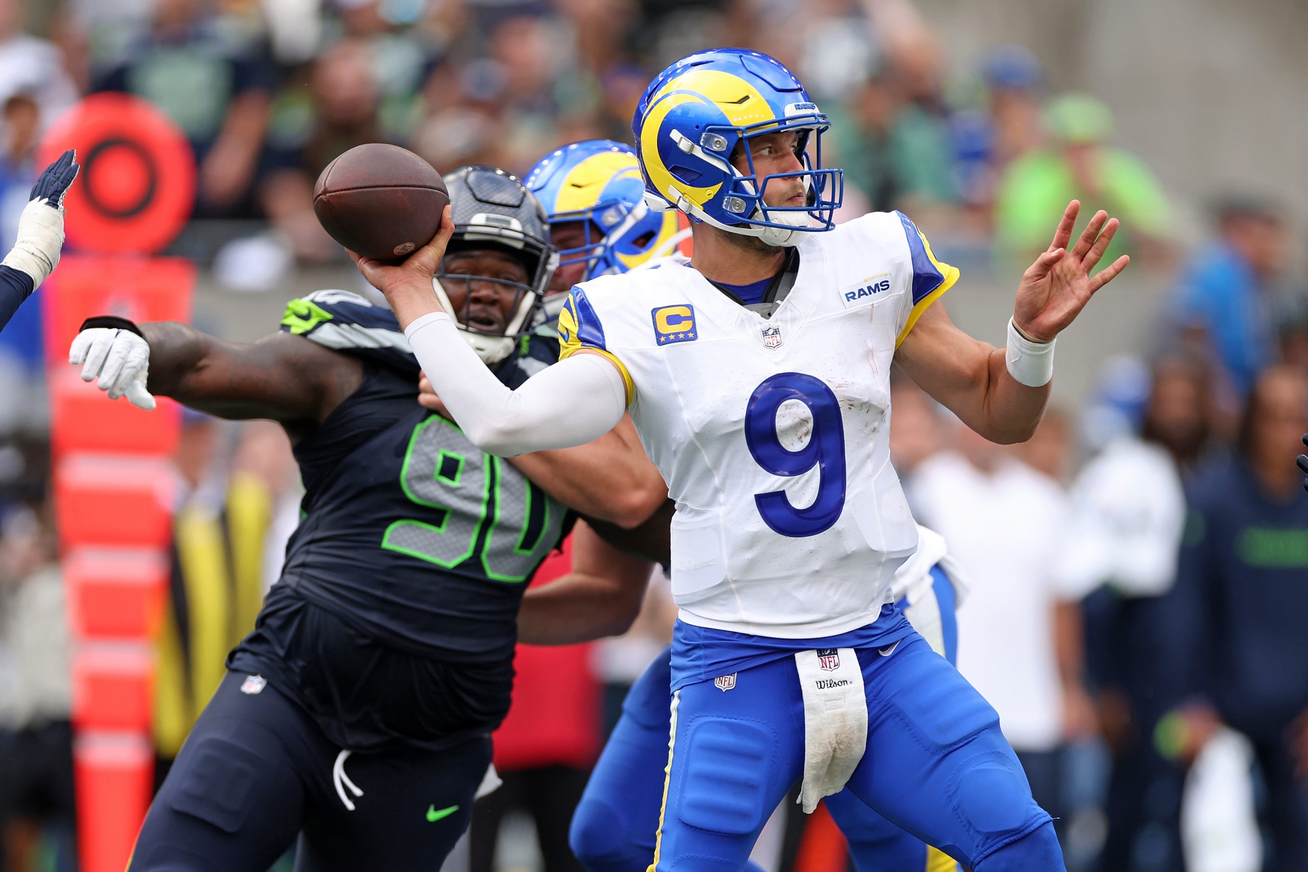 Matthew Stafford #9 of the Los Angeles Rams attempts a pass against the Seattle Seahawks during the...