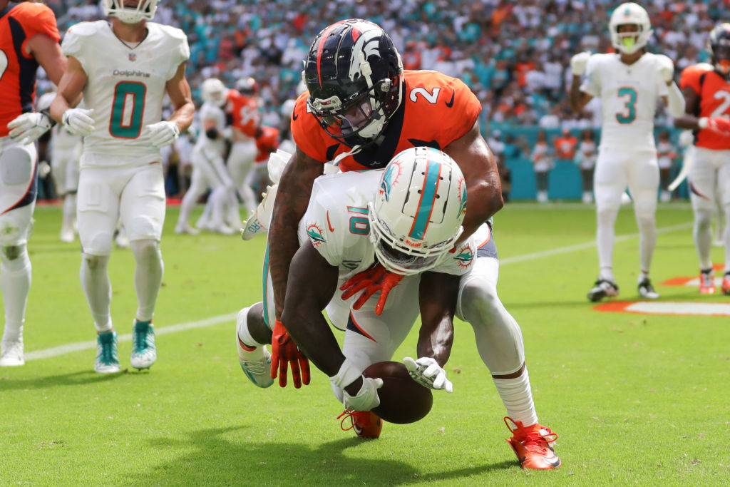 Pat Surtain II #2 of the Denver Broncos breaks up a pass intended for Tyreek Hill #10 of the Miami ...
