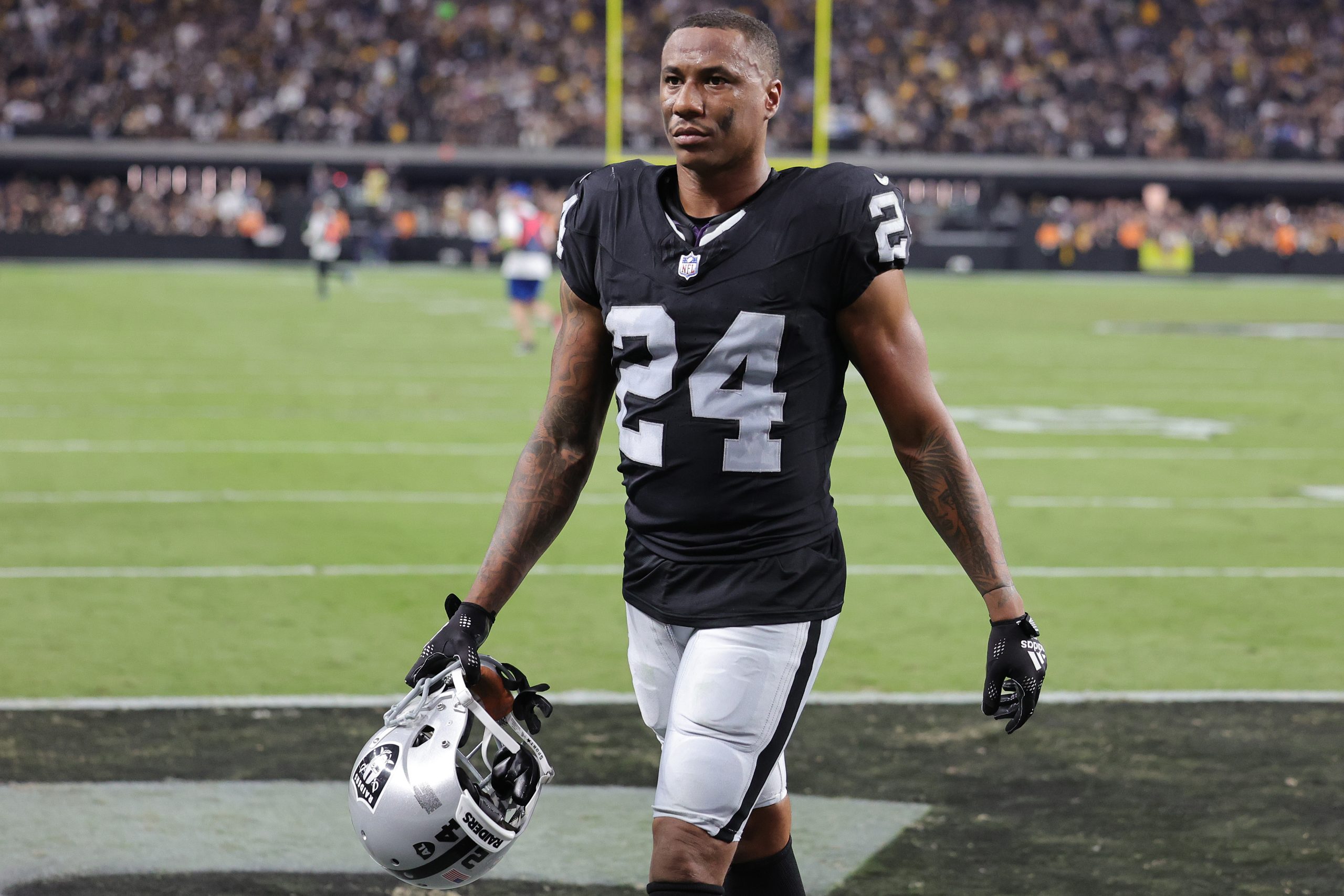 Marcus Peters #24 of the Las Vegas Raiders walks off the field at halftime against the Pittsburgh S...