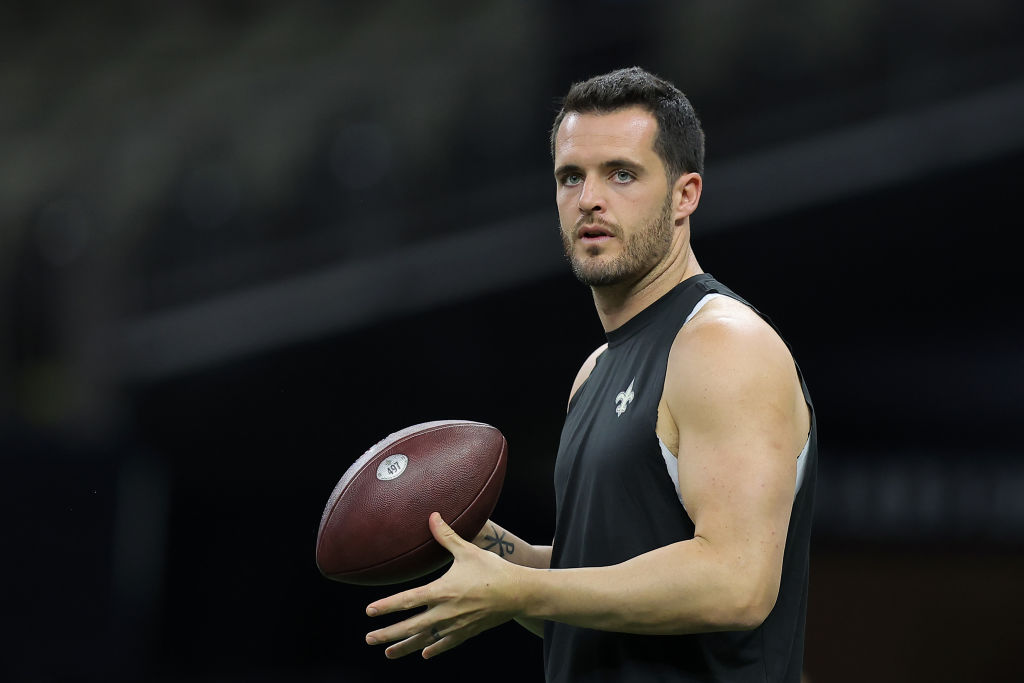 Derek Carr #4 of the New Orleans Saints warms up before the game against the Jacksonville Jaguars a...