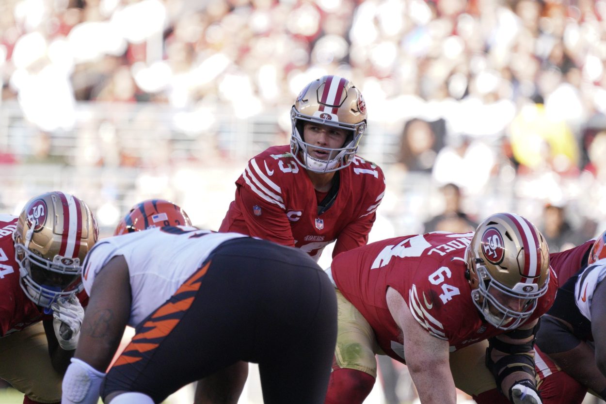 Brock Purdy #13 of the San Francisco 49ers calls a play during the third quarter of the game agains...