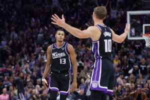 SACRAMENTO, CALIFORNIA - OCTOBER 29: Domantas Sabonis #10 of the Sacramento Kings reacts after a three-point basket made by teammate Keegan Murray #13 in the fourth quarter L at Golden 1 Center on October 29, 2023 in Sacramento, California. NOTE TO USER: User expressly acknowledges and agrees that, by downloading and or using this photograph, User is consenting to the terms and conditions of the Getty Images License Agreement. (Photo by Lachlan Cunningham/Getty Images)