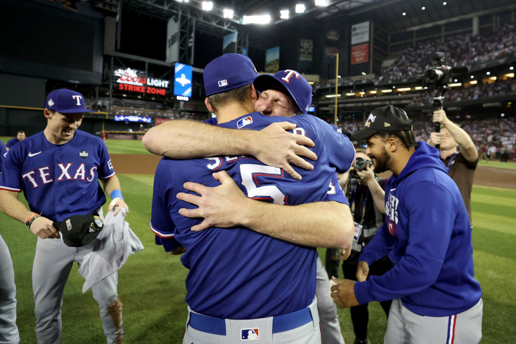 Corey Seager #5 of the Texas Rangers celebrates with teammates after the Texas Rangers beat the Ari...