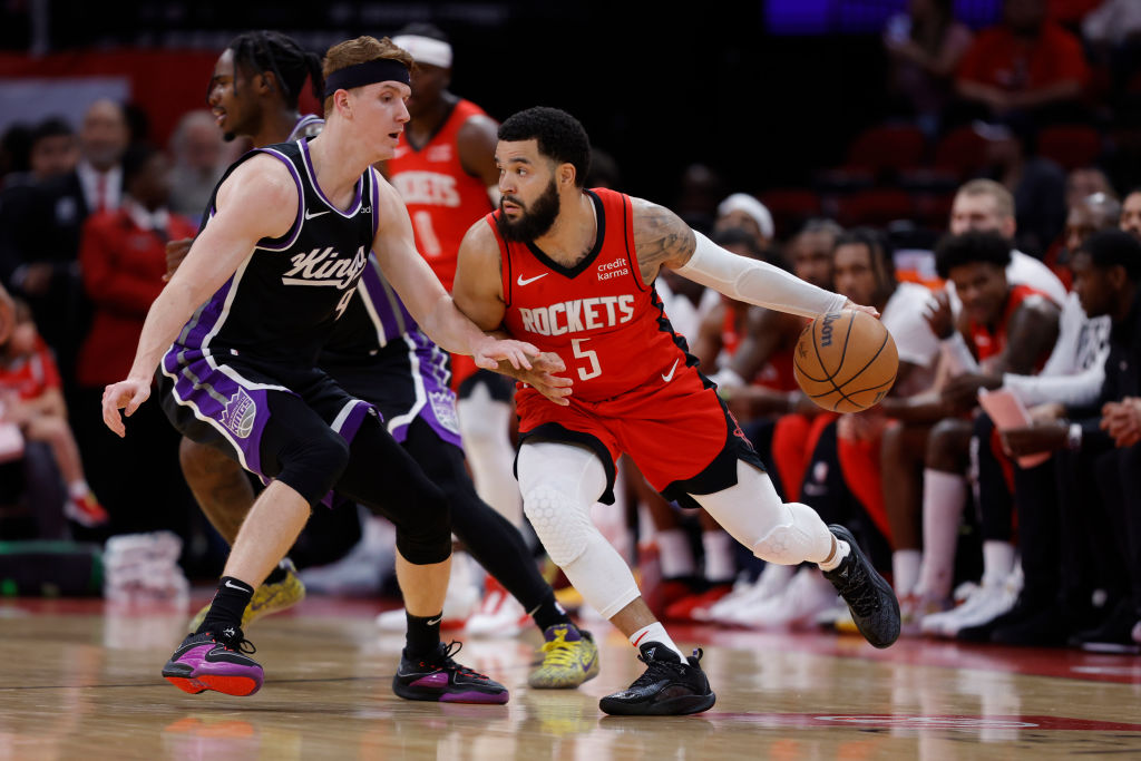 Fred VanVleet #5 of the Houston Rockets controls the ball around defender Kevin Huerter #9 of the S...