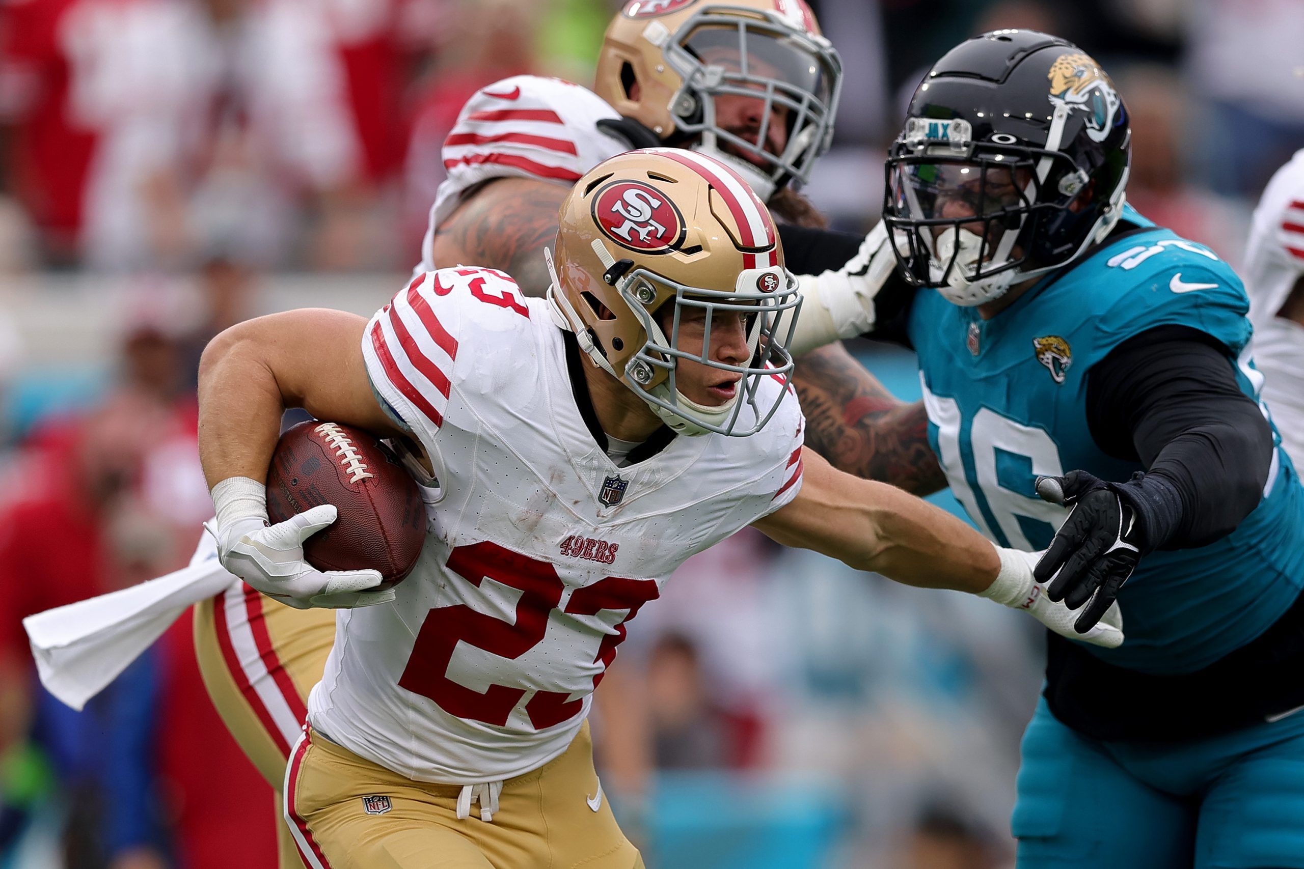 Christian McCaffrey #23 of the San Francisco 49ers runs with the ball during the second quarter aga...