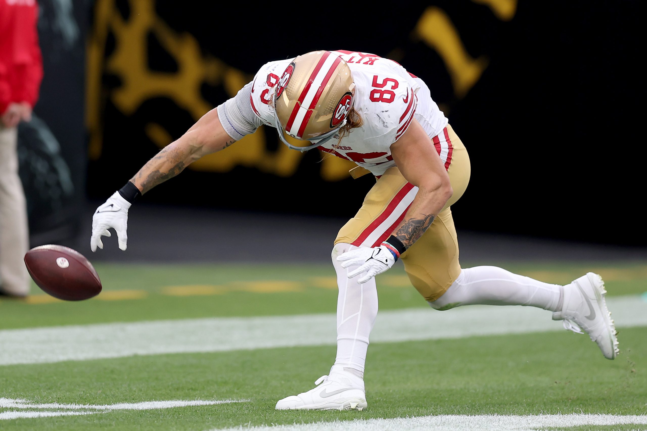 George Kittle #85 of the San Francisco 49ers spikes the ball after a touchdown during the third qua...
