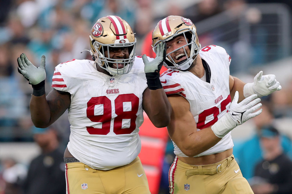 Nick Bosa #97 celebrates a sack with Javon Hargrave #98 of the San Francisco 49ers defense during t...