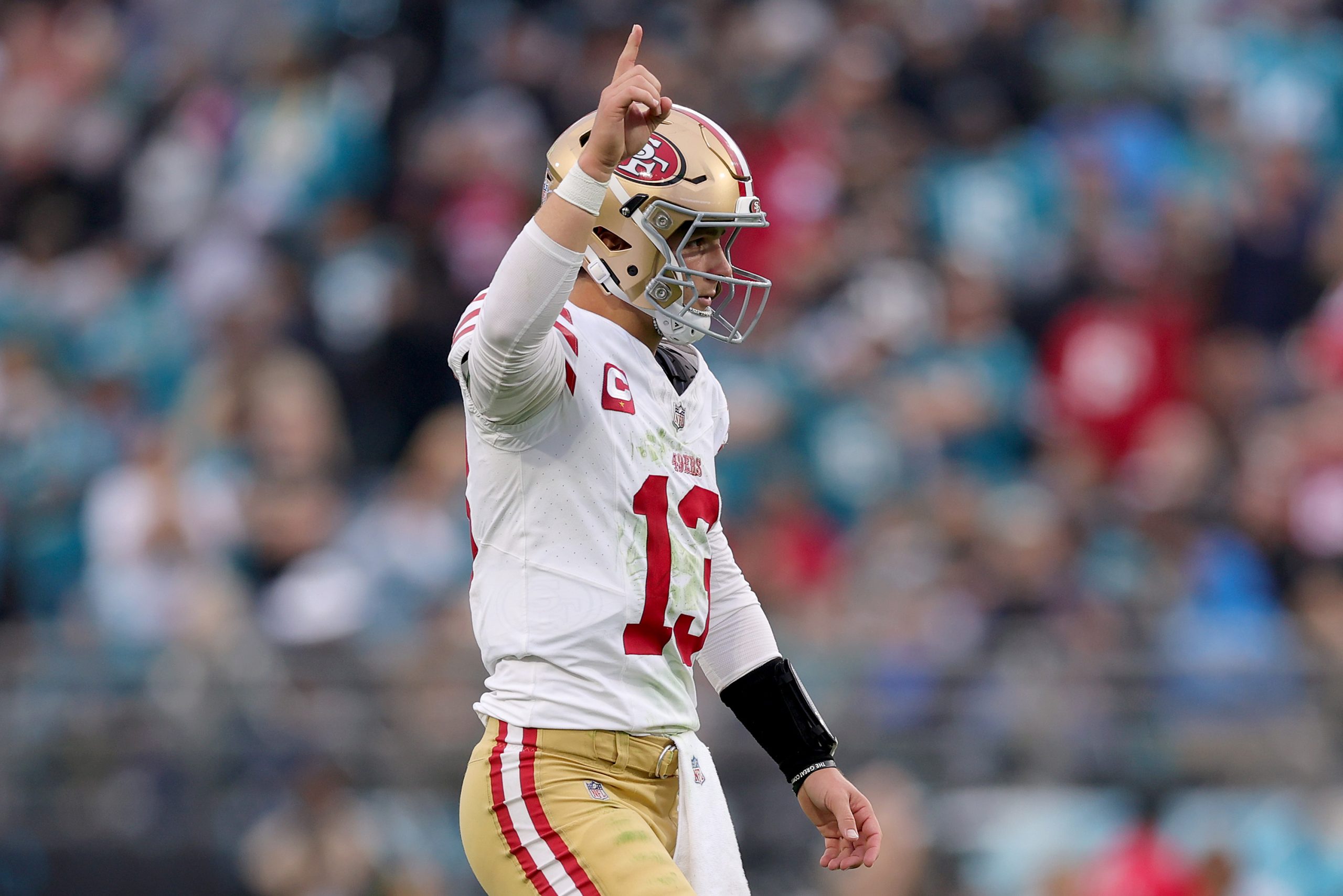 Brock Purdy #13 of the San Francisco 49ers reacts after a touchdown pass during the third quarter a...