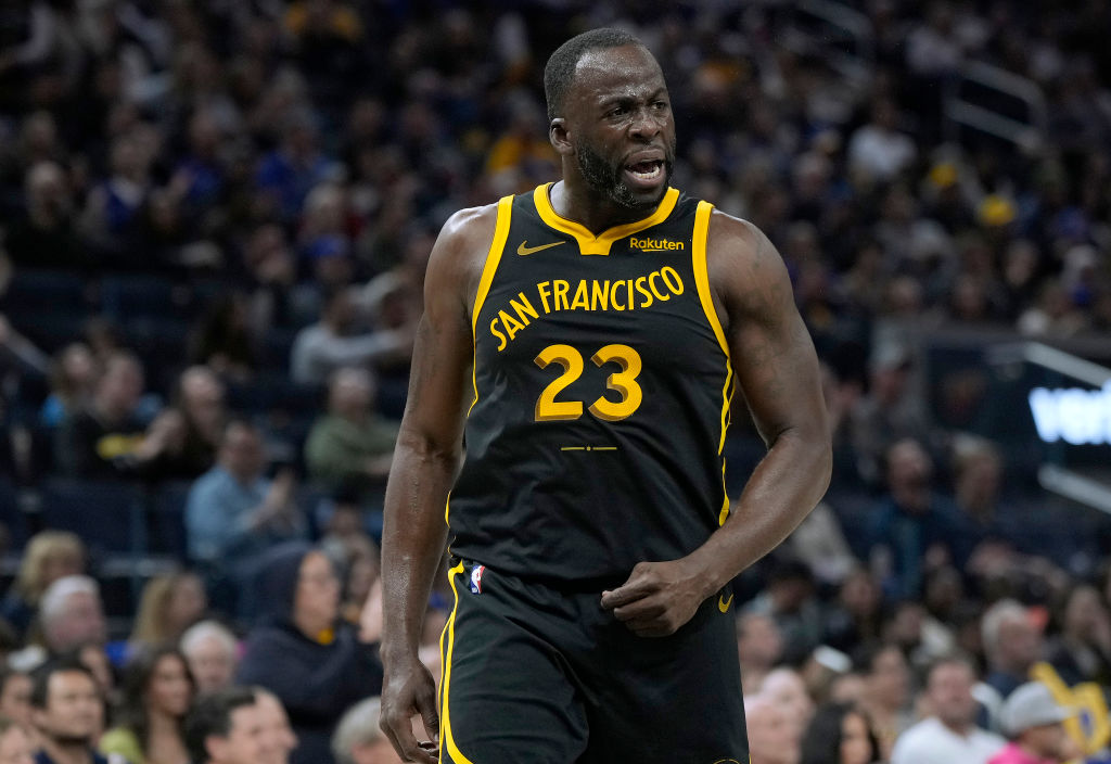Draymond Green #23 of the Golden State Warriors reacts after stealing the ball from Donovan Mitchel...