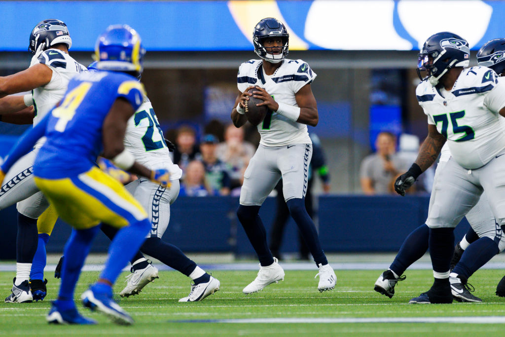 Geno Smith #7 of the Seattle Seahawks drops back to pass during a game against the Los Angeles Rams...