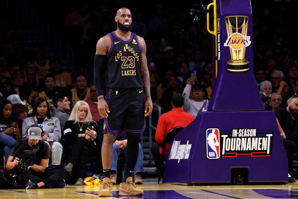 LeBron James #23 of the Los Angeles Lakers looks down court during a break in the first half agains...