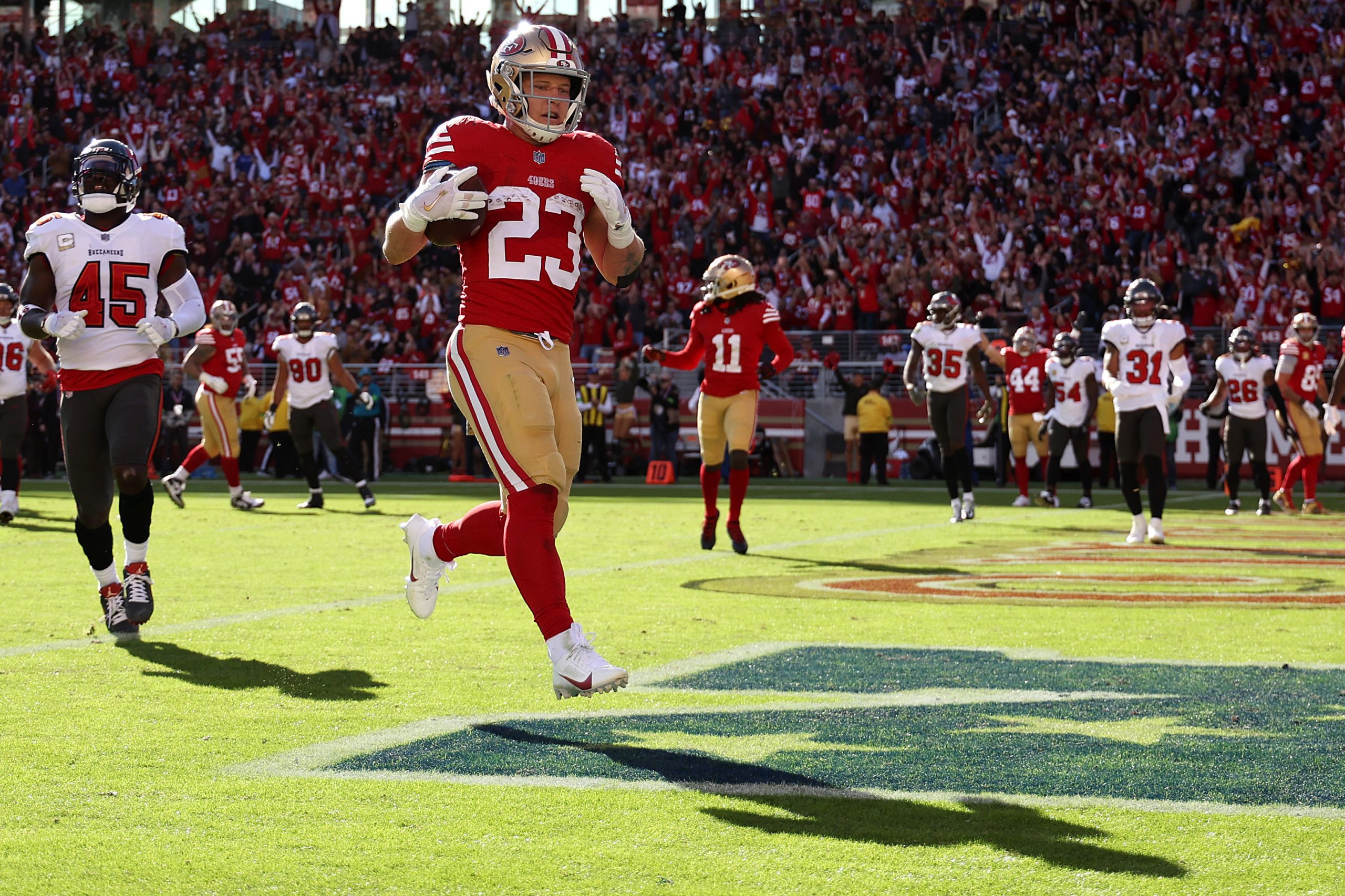 Christian McCaffrey #23 of the San Francisco 49ers scores a touchdown during the first quarter of a...