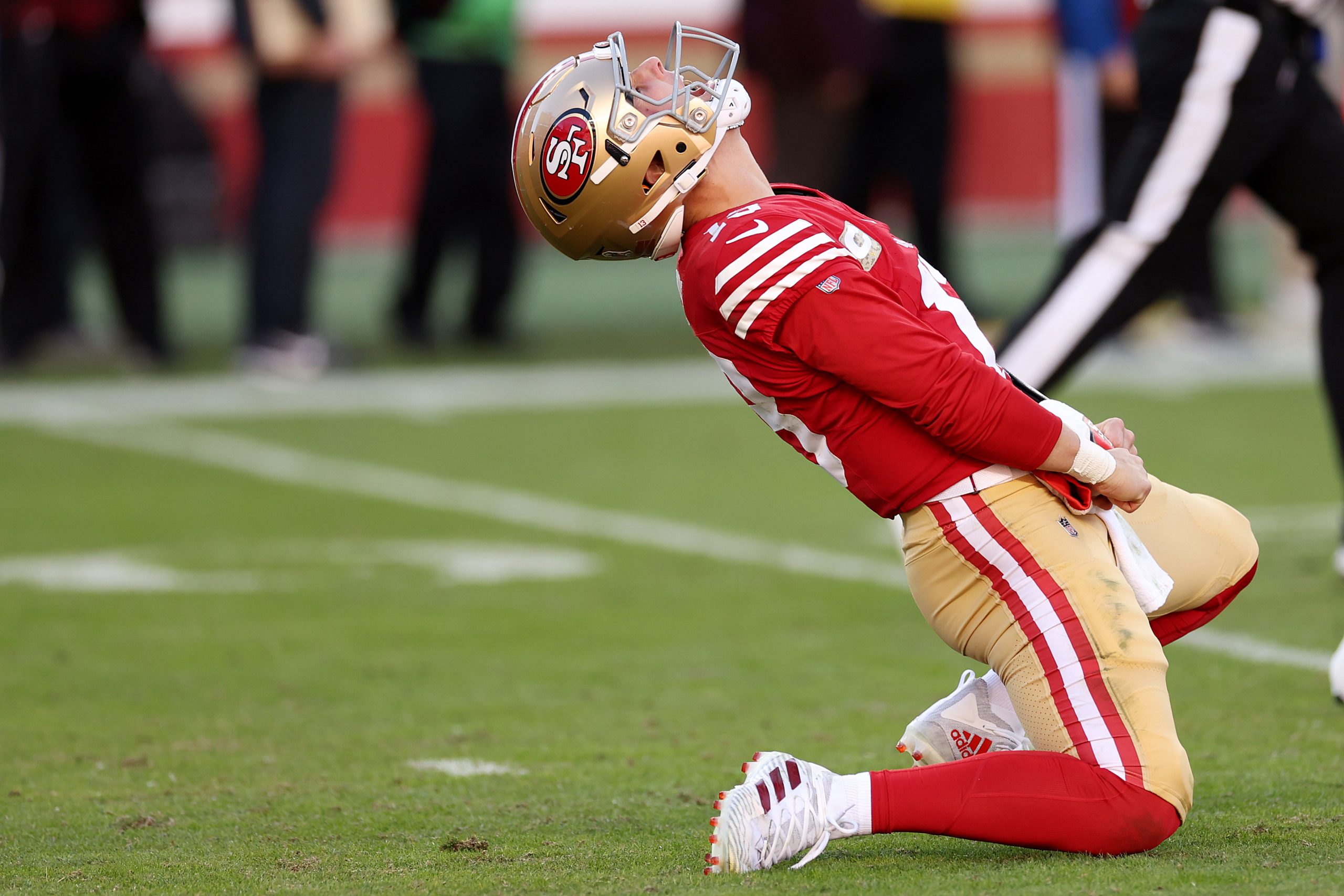 Brock Purdy #13 of the San Francisco 49ers reacts after throwing a pass for a touchdown during the ...