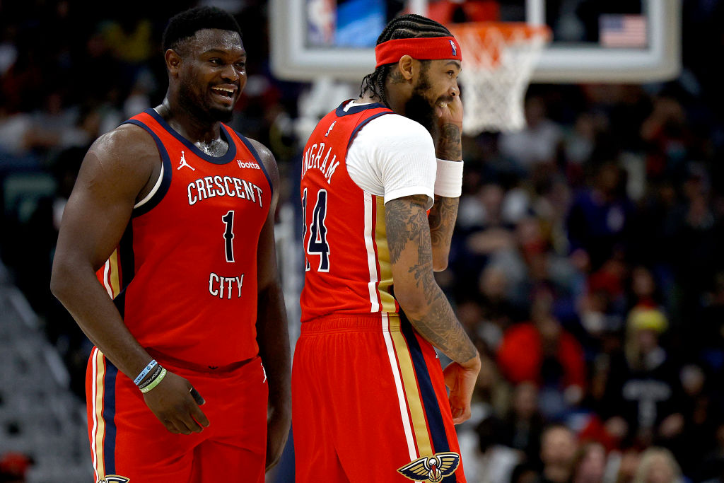 Zion Williamson #1 and Brandon Ingram #14 of the New Orleans Pelicans react after a play during the...