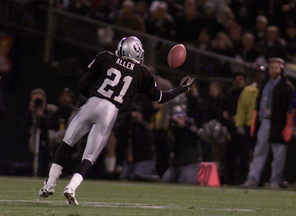 Eric Allen of the Raiders intercepts the ball during the New York Jets v Oakland Raiders NFL game a...