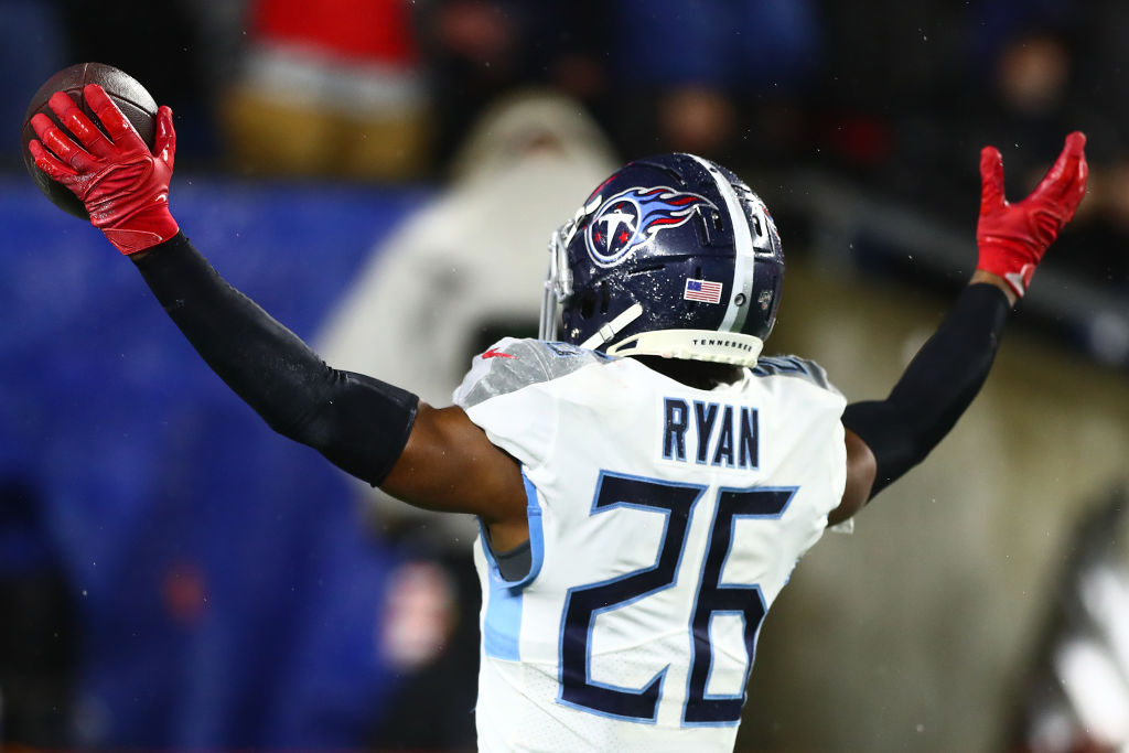 Logan Ryan #26 of the Tennessee Titans celebrates his touchdown against the New England Patriots in...