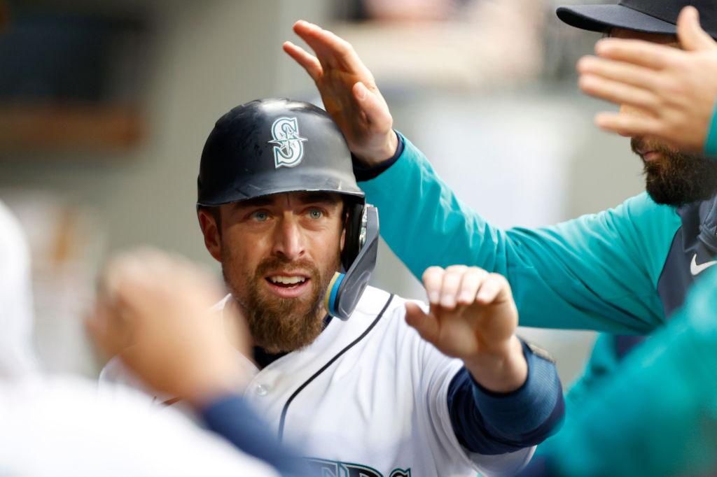 SEATTLE, WASHINGTON - APRIL 23: Tom Murphy #2 of the Seattle Mariners scores on an RBI single by Ja...