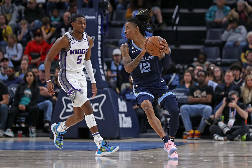 Ja Morant #12 of the Memphis Grizzlies handles the ball during the game against the Sacramento King...