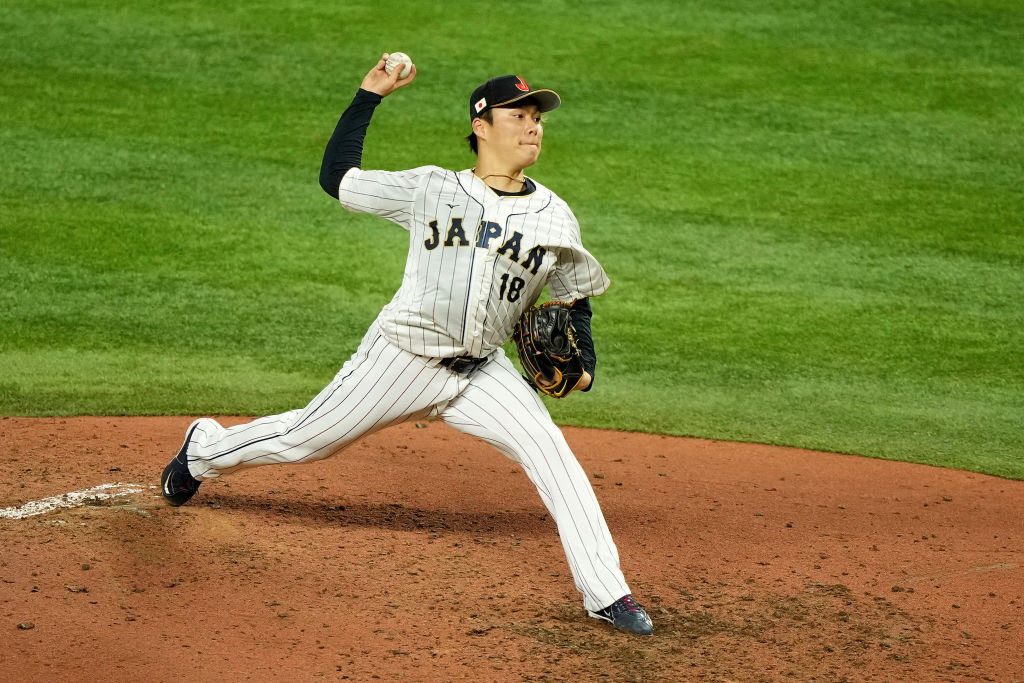 Yoshinobu Yamamoto #18 of Team Japan delivers a pitch against Team Mexico during the fifth inning d...