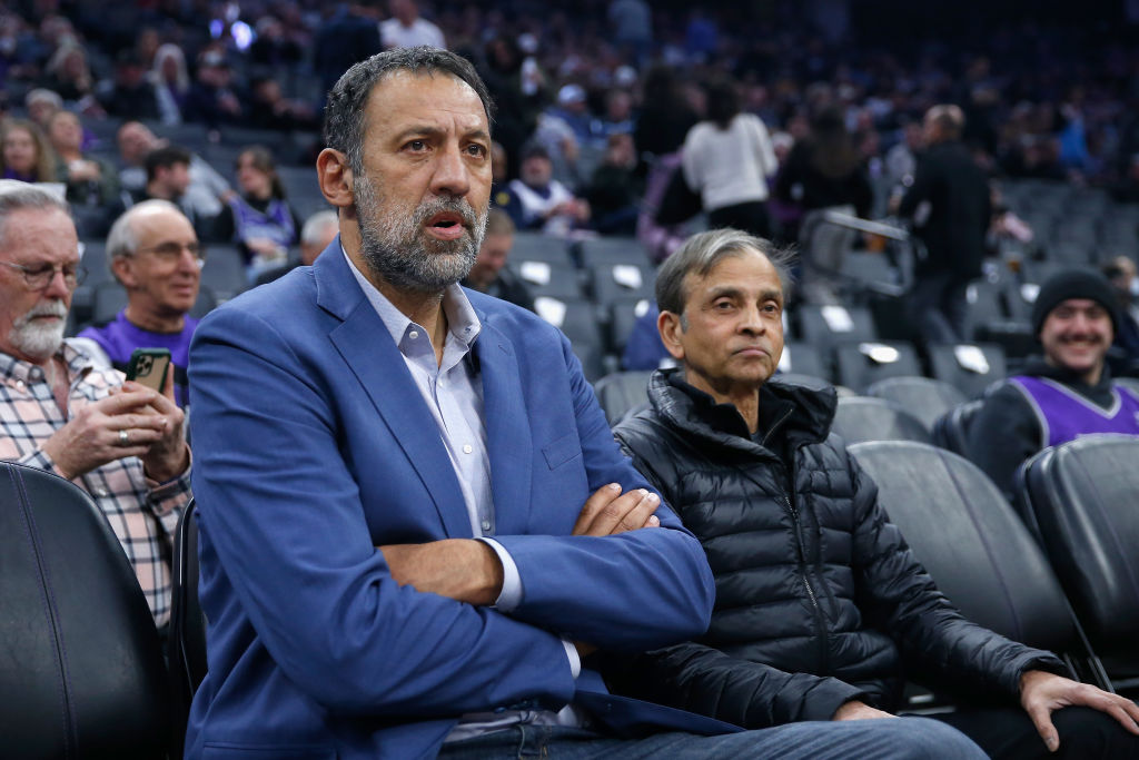 Former Sacramento Kings player Vlade Divac sits with Kings owner Vivek Ranadive before the game aga...