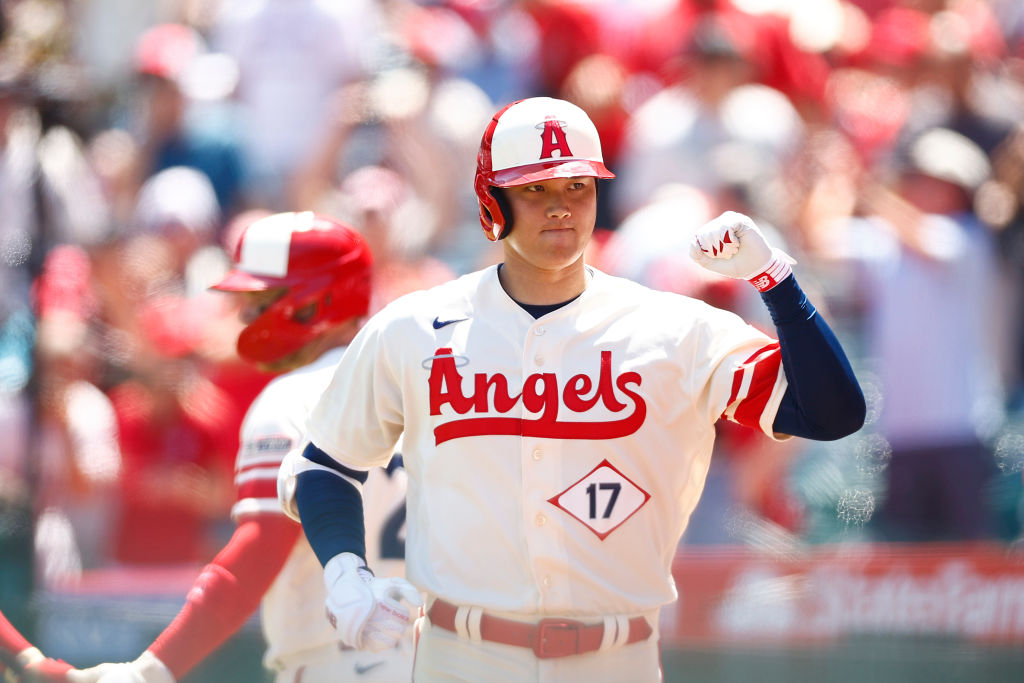 ANAHEIM, CALIFORNIA - AUGUST 23: Shohei Ohtani #17 of the Los Angeles Angels hits a two-run home ru...