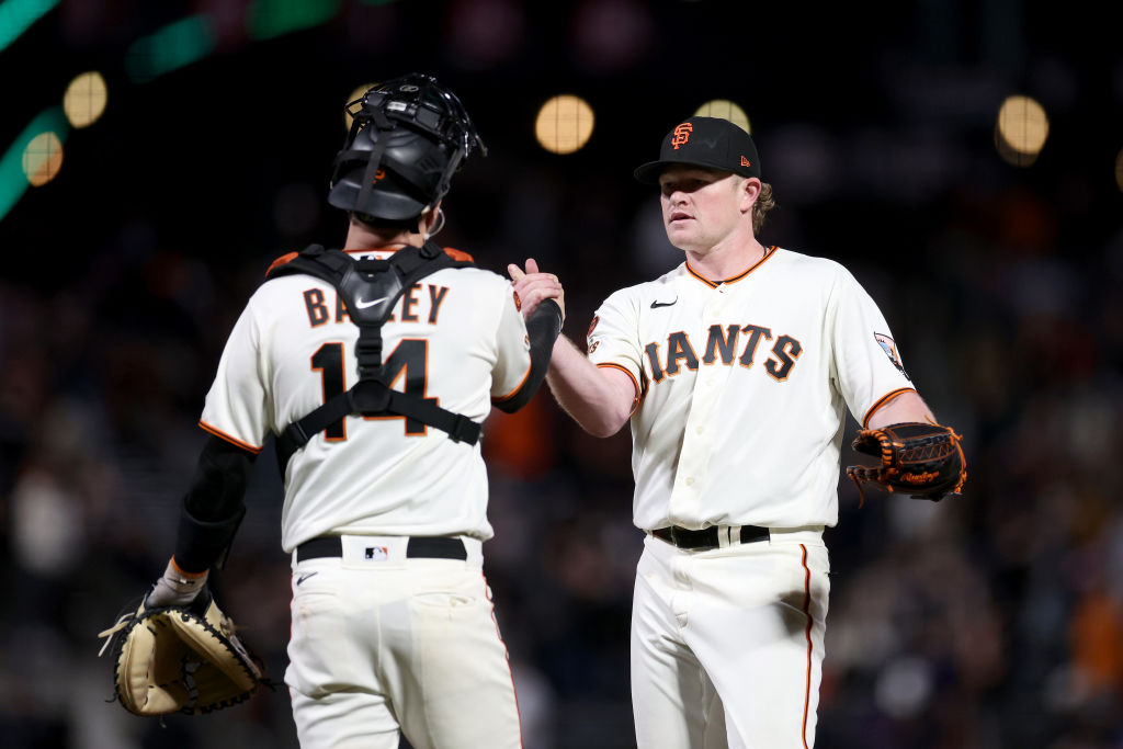 Logan Webb #62 shakes hands with Patrick Bailey #14 of the San Francisco Giants after they beat the...