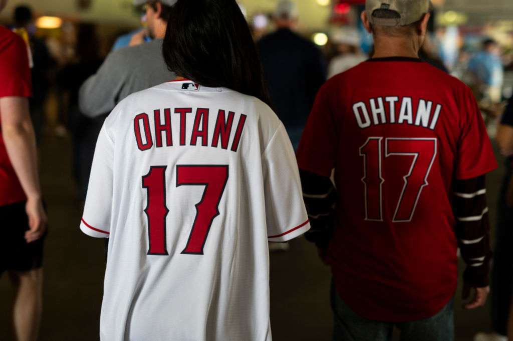 Fans wear the jersey of Shohei Ohtani #17 Los Angeles Angels before the game against the Minnesota ...