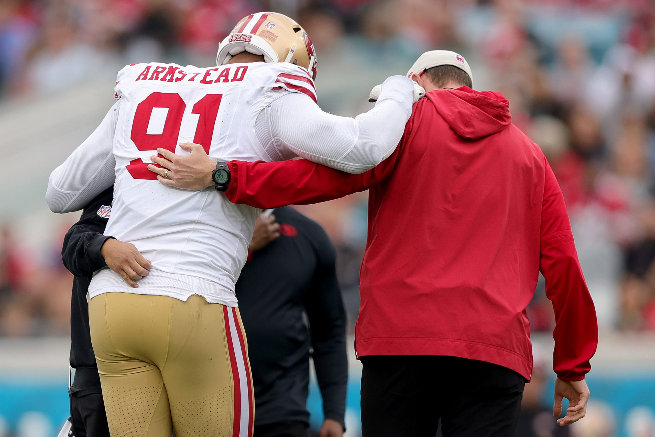 Arik Armstead #91 of the San Francisco 49ers walks off the field with an apparent injury during the...