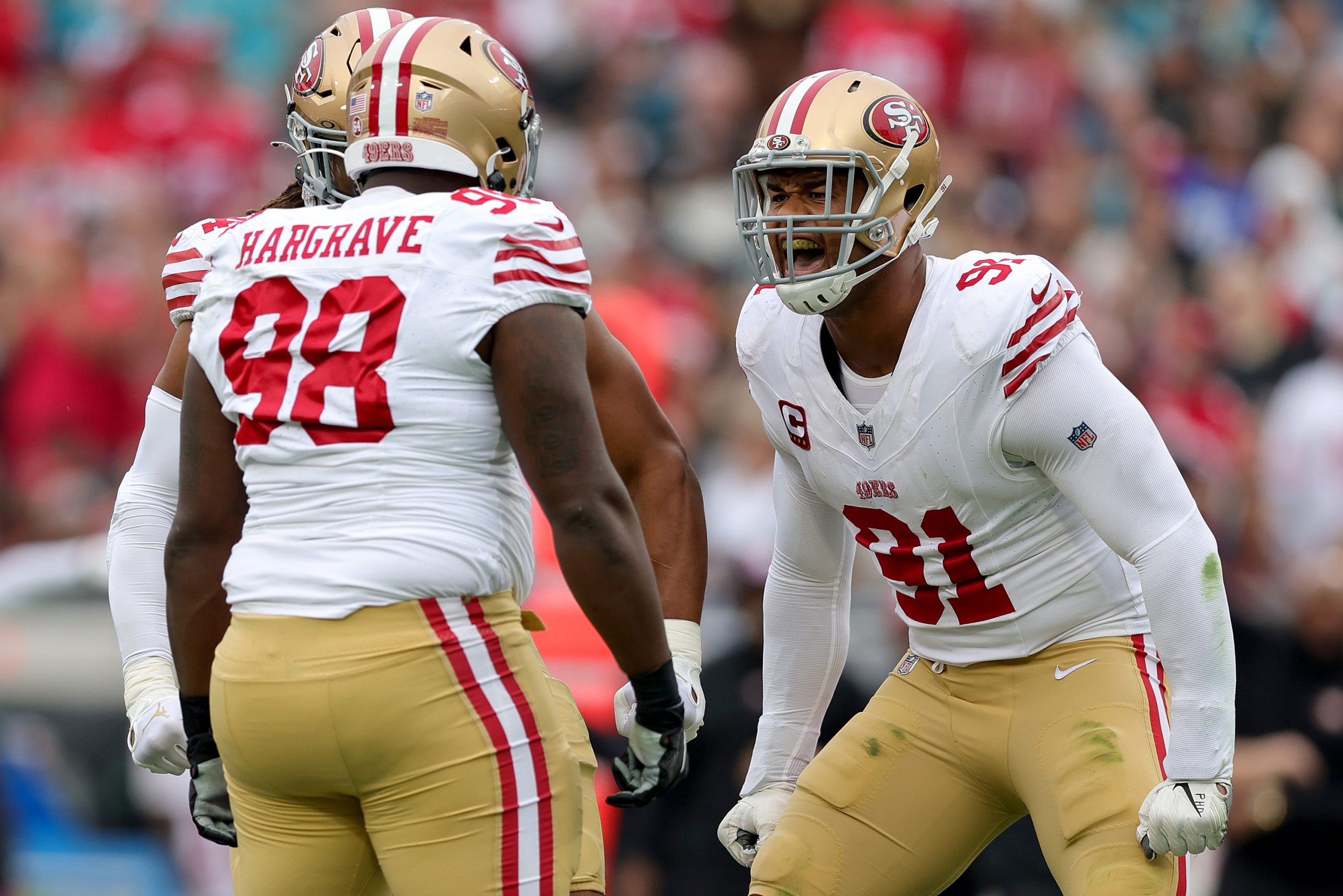 Arik Armstead #91 of the San Francisco 49ers celebrates a sack by Javon Hargrave #98 of the San Fra...