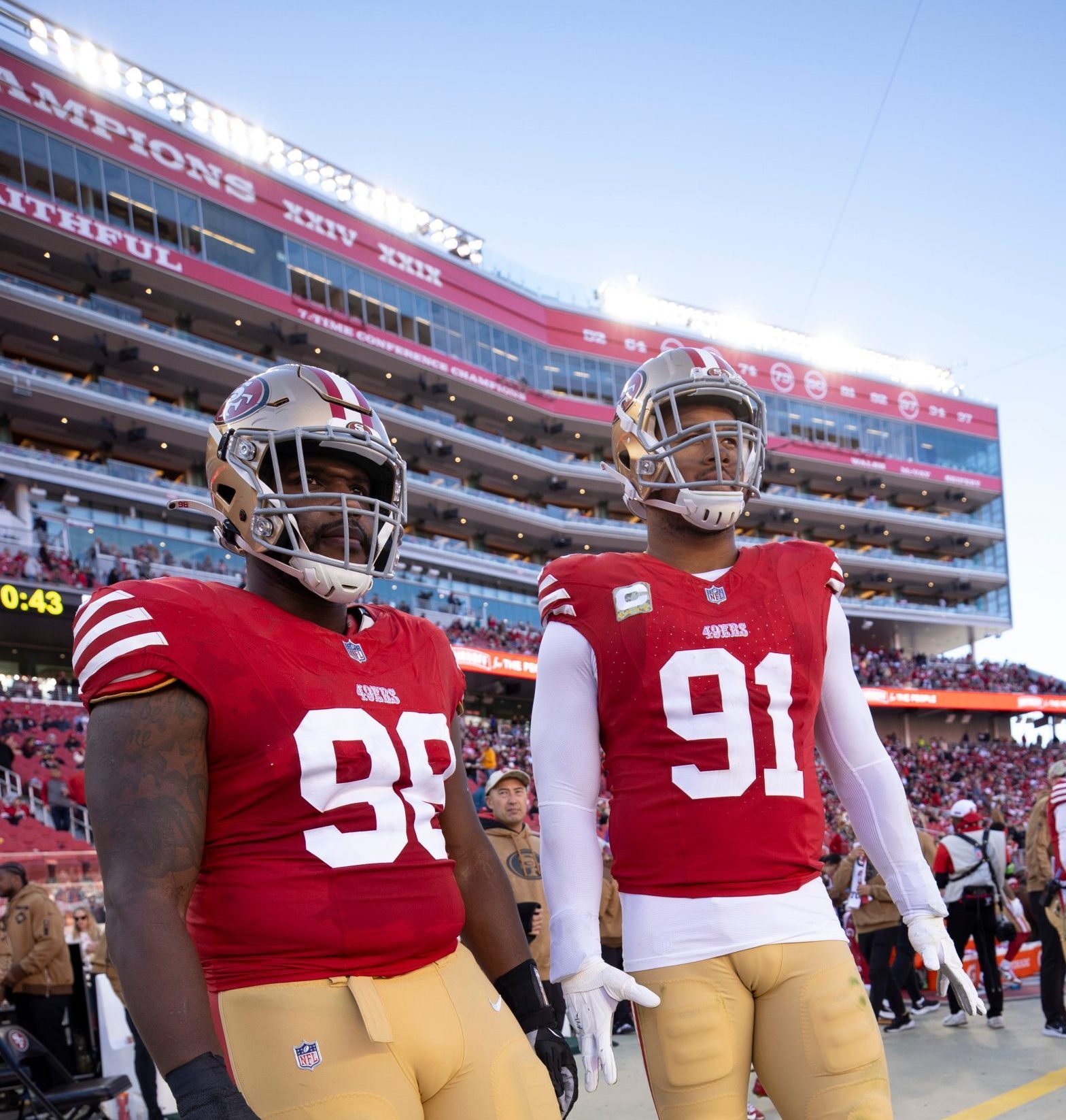 Javon Hargrave #98 and Arik Armstead #91 of the San Francisco 49ers on the sideline during the game...