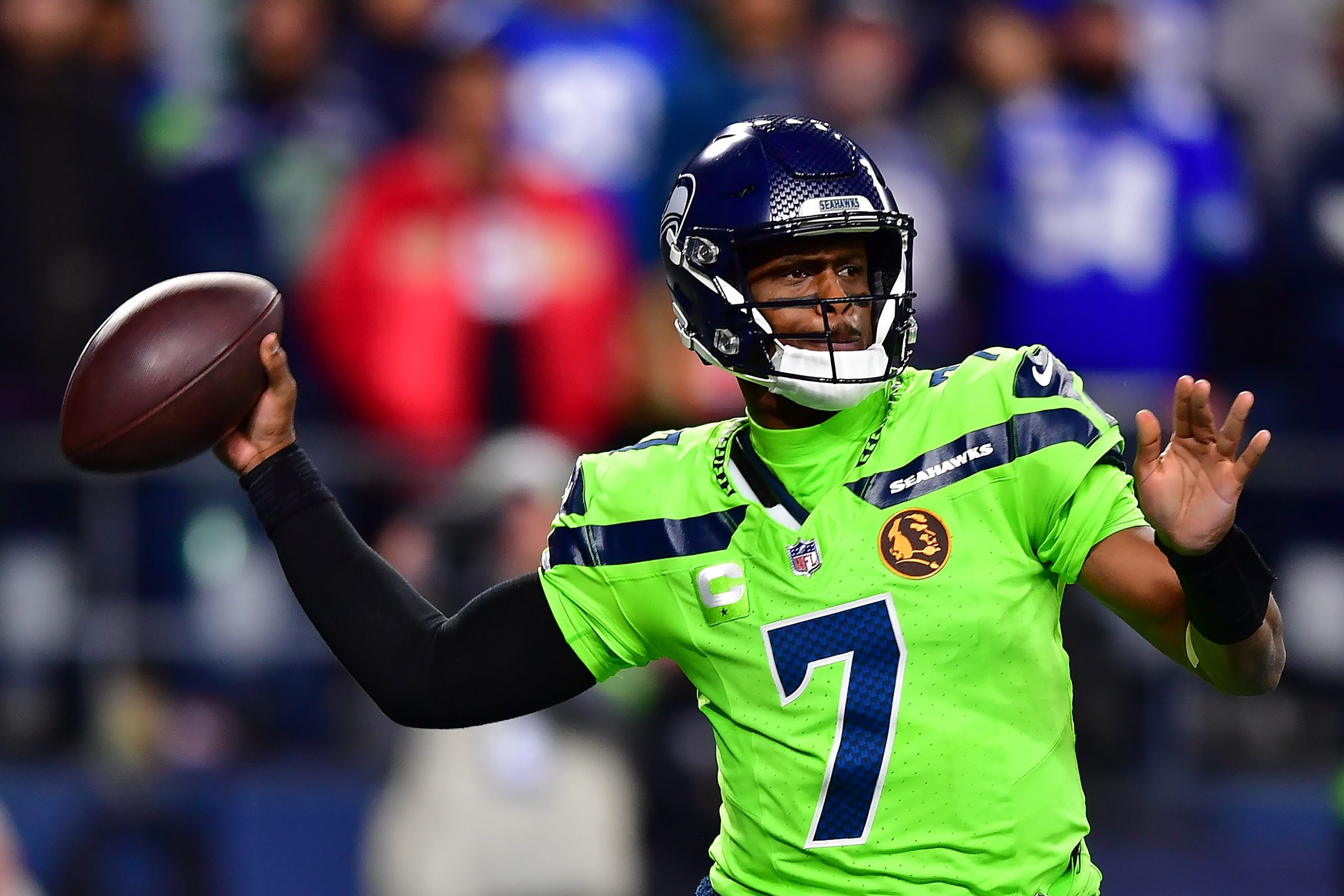 Geno Smith #7 of the Seattle Seahawks looks to pass during the second quarter of a game against the...
