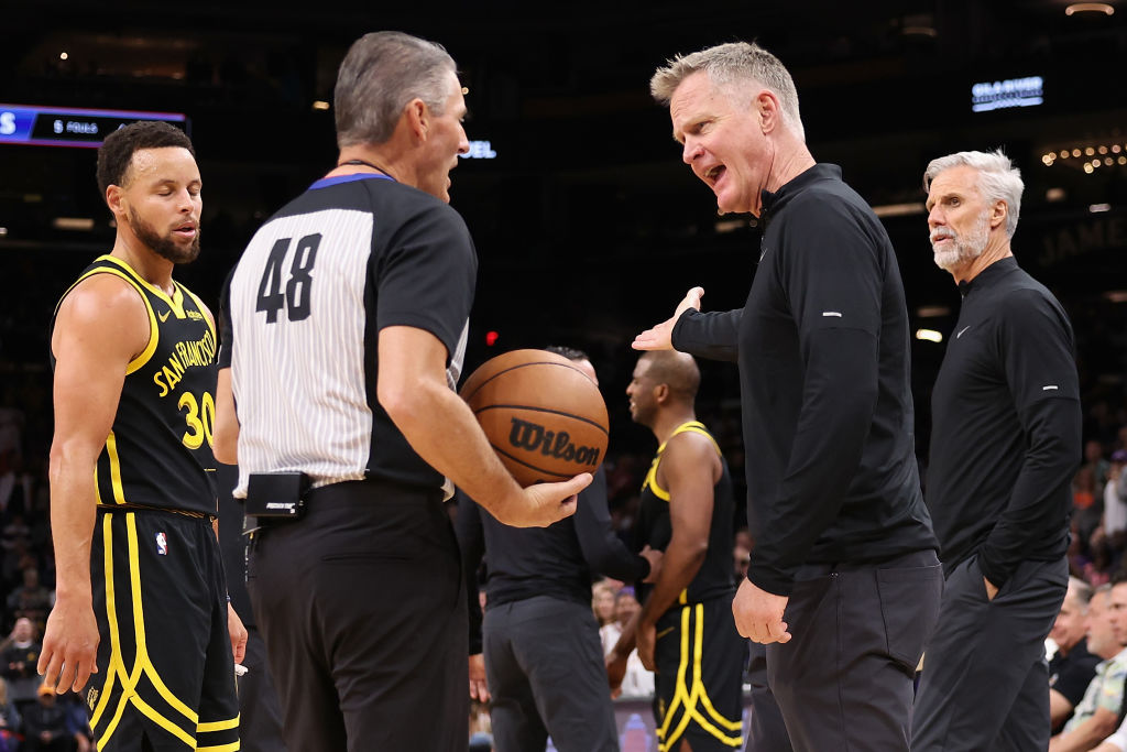 Head coach Steve Kerr of the Golden State Warriors reacts to referee Scott Foster #48 during the fi...