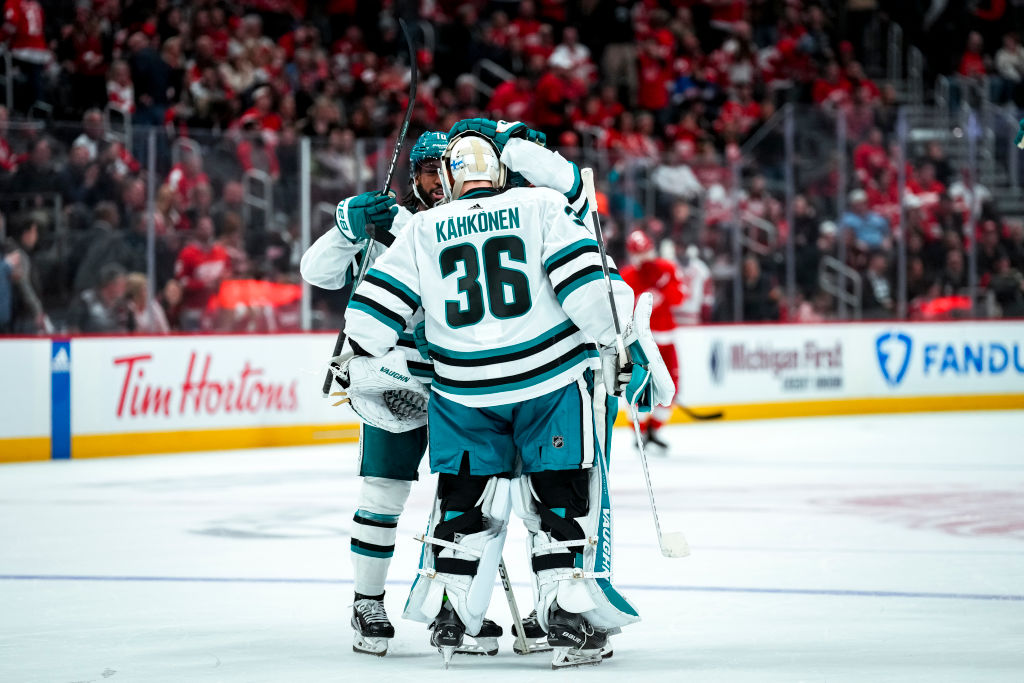 Anthony Duclair #10, Kyle Burroughs #4 and Kaapo Kahkonen #36 of the San Jose Sharks celebrate afte...