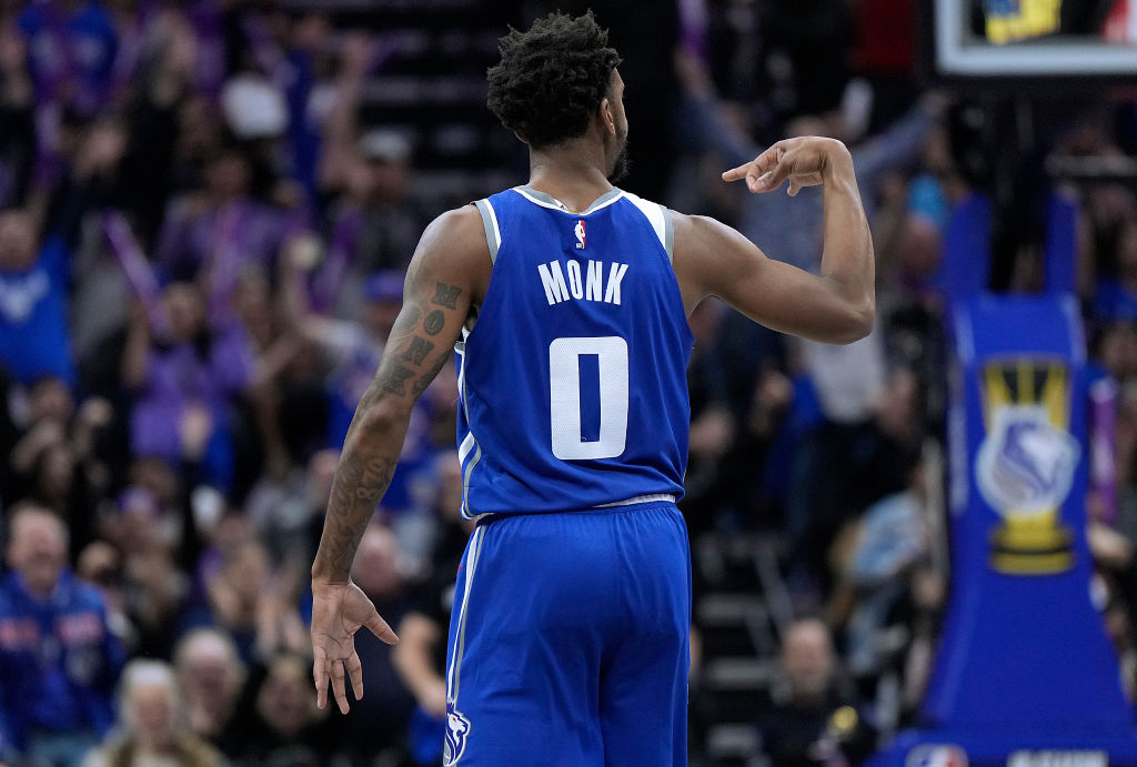 Malik Monk #0 of the Sacramento Kings reacts after making a three-point shot against the New Orlean...