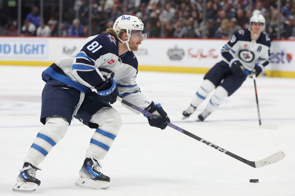 Kyle Connor #81 of the Winnipeg Jets looks for an opening against the Colorado Avalanche in the fir...