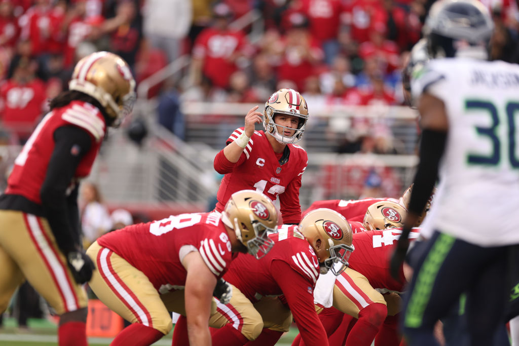 Brock Purdy #13 of the San Francisco 49ers directs his team during the third quarter in the game ag...
