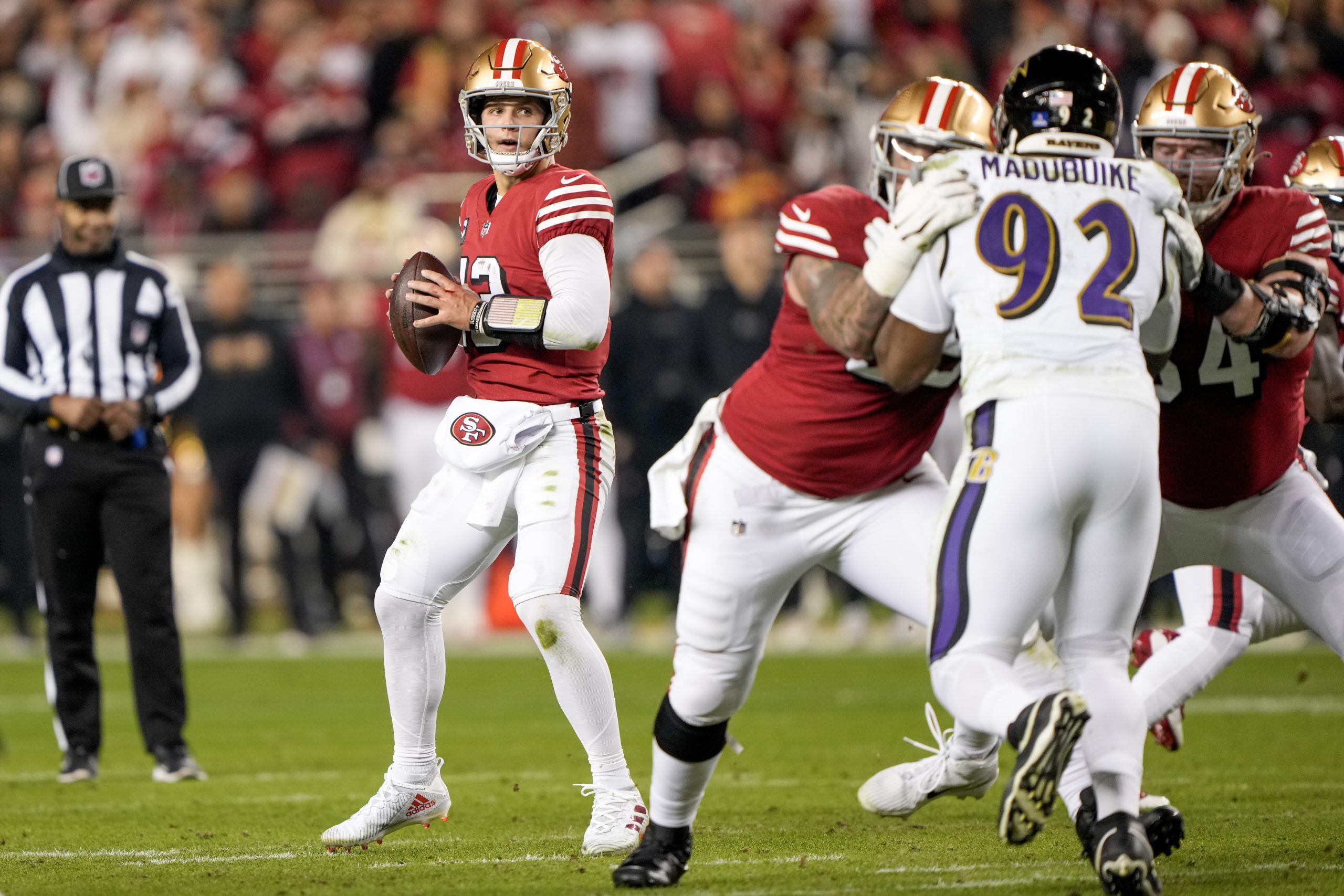 Brock Purdy #13 of the San Francisco 49ers attempts a pass during the first quarter against the Bal...