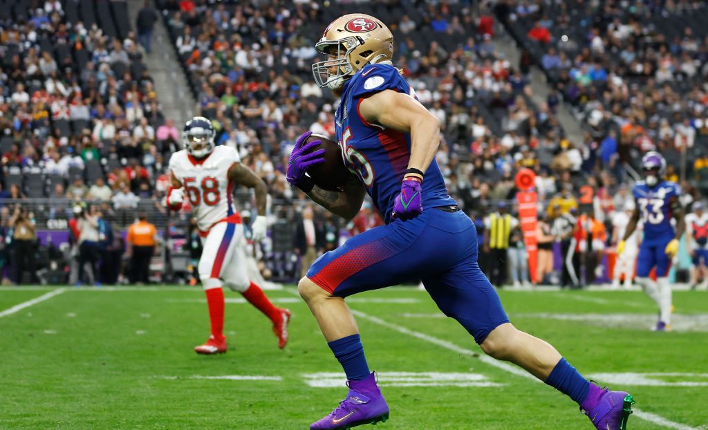 George Kittle #85 of the San Francisco 49ers and NFC carries the ball against the AFC in the second...