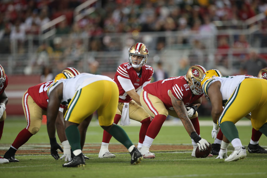 Brock Purdy #14 of the San Francisco 49ers waits for the snap during the game against the Green Bay...
