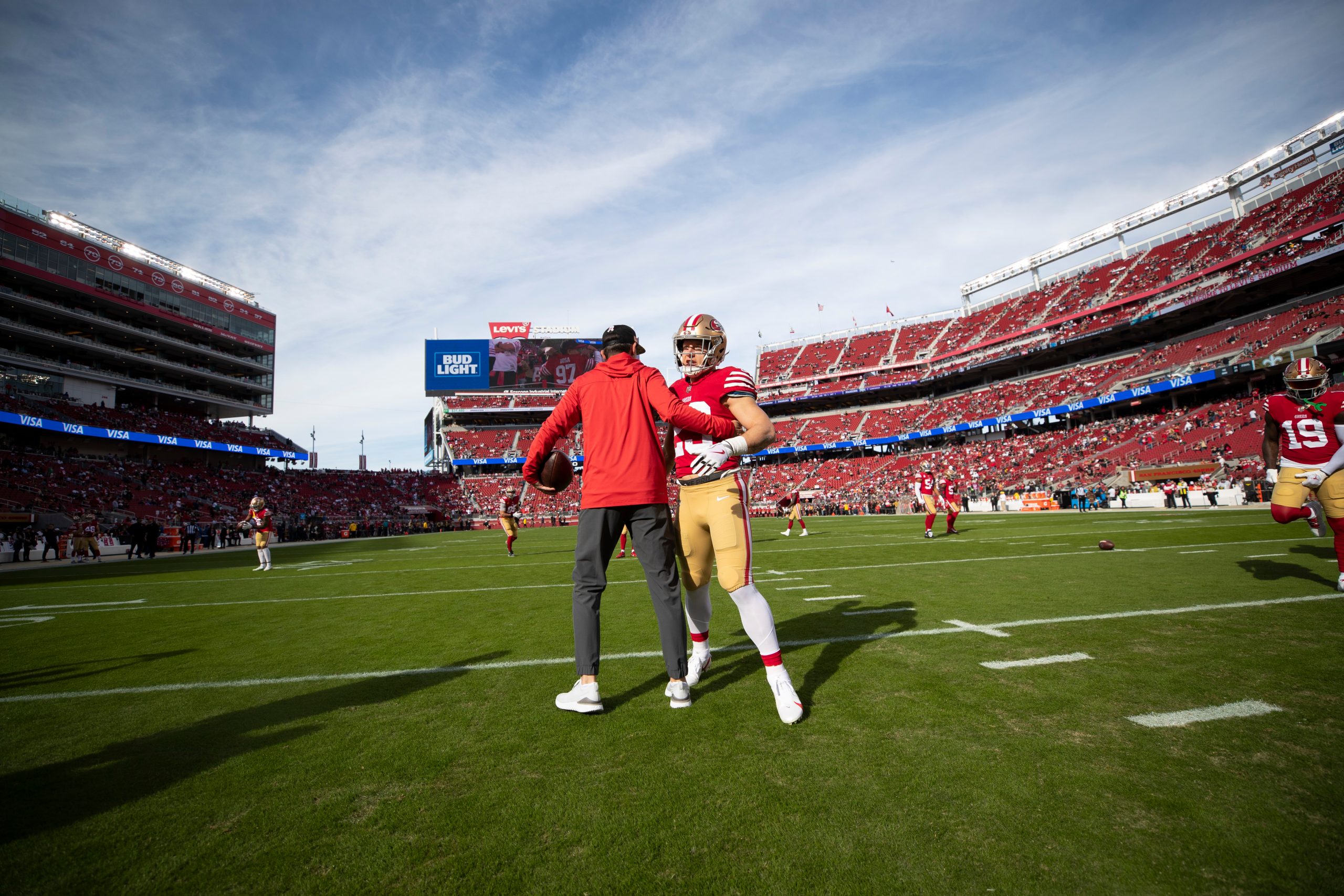 Head Coach Kyle Shanahan and Christian McCaffrey #23 of the San Francisco 49ers on the field before...