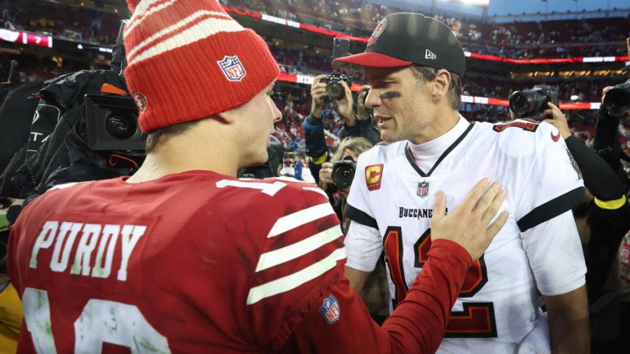 Brock Purdy #13 of the San Francisco 49ers talks with Tom Brady #12 of the Tampa Bay Buccaneers following the game at Levi's Stadium on December 11, 2022 in Santa Clara, California. San Francisco defeated Tampa Bay 35-7.
