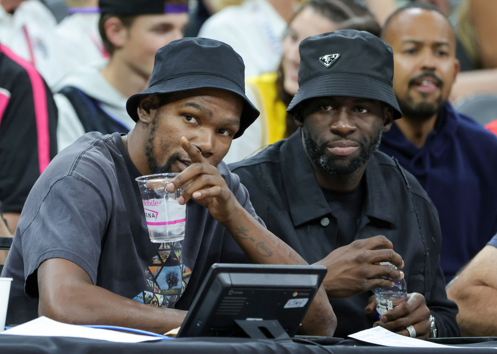 NBA players Kevin Durant (L) and Draymond Green attend a 2023 FIBA World Cup exhibition game betwee...