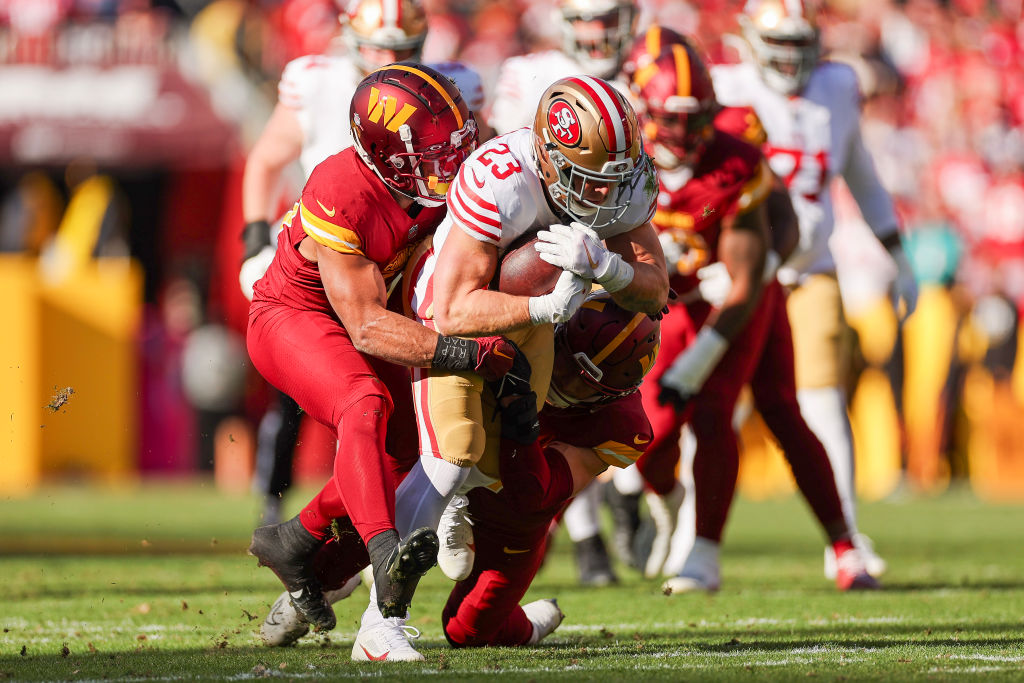 Christian McCaffrey #23 of the San Francisco 49ers runs with the ball during the first quarter of a...
