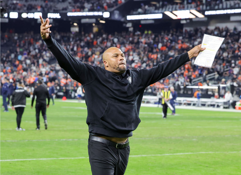 Antonio Pierce of the Las Vegas Raiders gestures to fans as he runs off the field after the team's ...