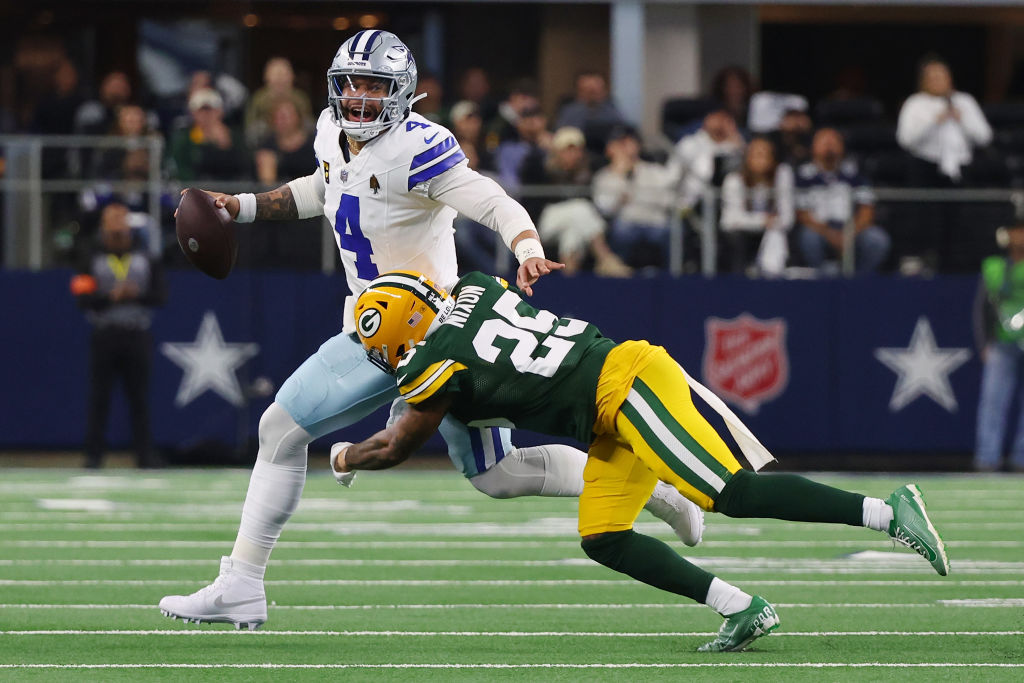 Dak Prescott #4 of the Dallas Cowboys is sacked by Keisean Nixon #25 of the Green Bay Packers durin...