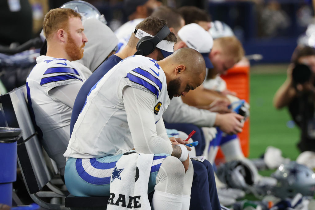 ARLINGTON, TEXAS - JANUARY 14: Dak Prescott #4 of the Dallas Cowboys sits on the bench during the f...