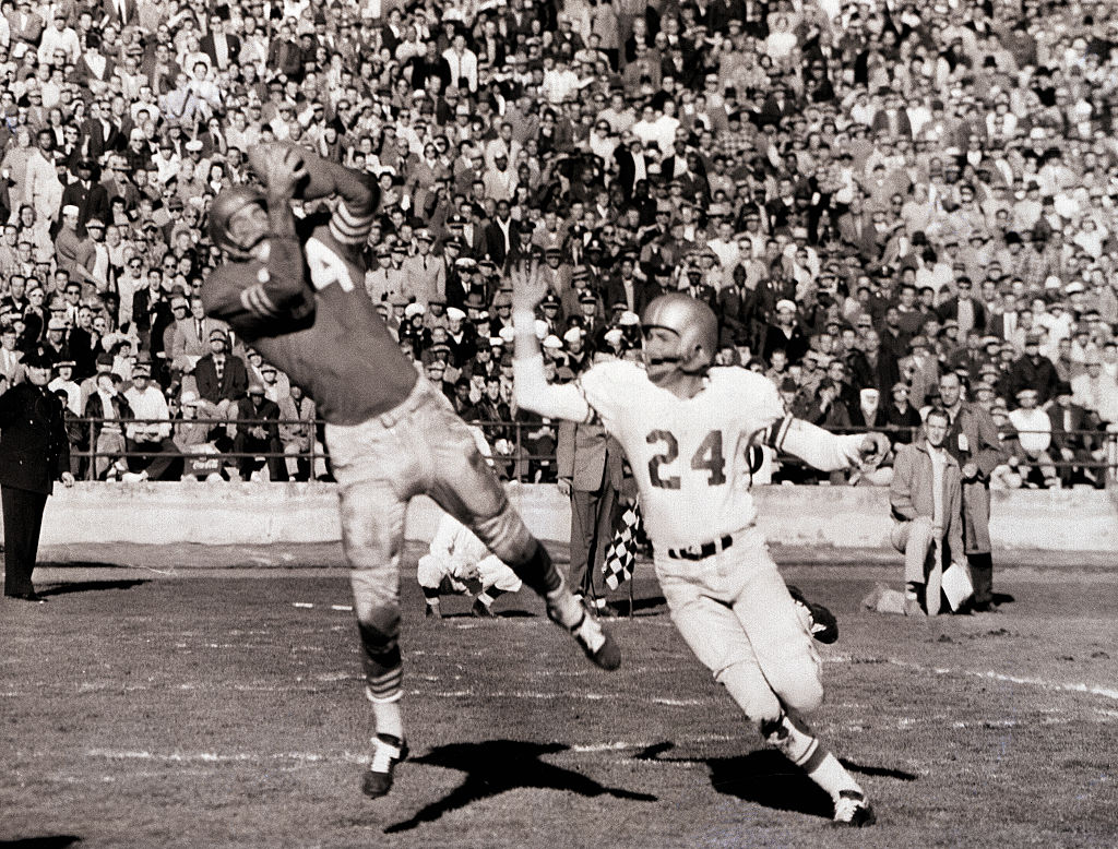 Forty-Niner end Billy Wilson (84) snags pass from teammate Y.A. Tittle, good for a touchdown in the...