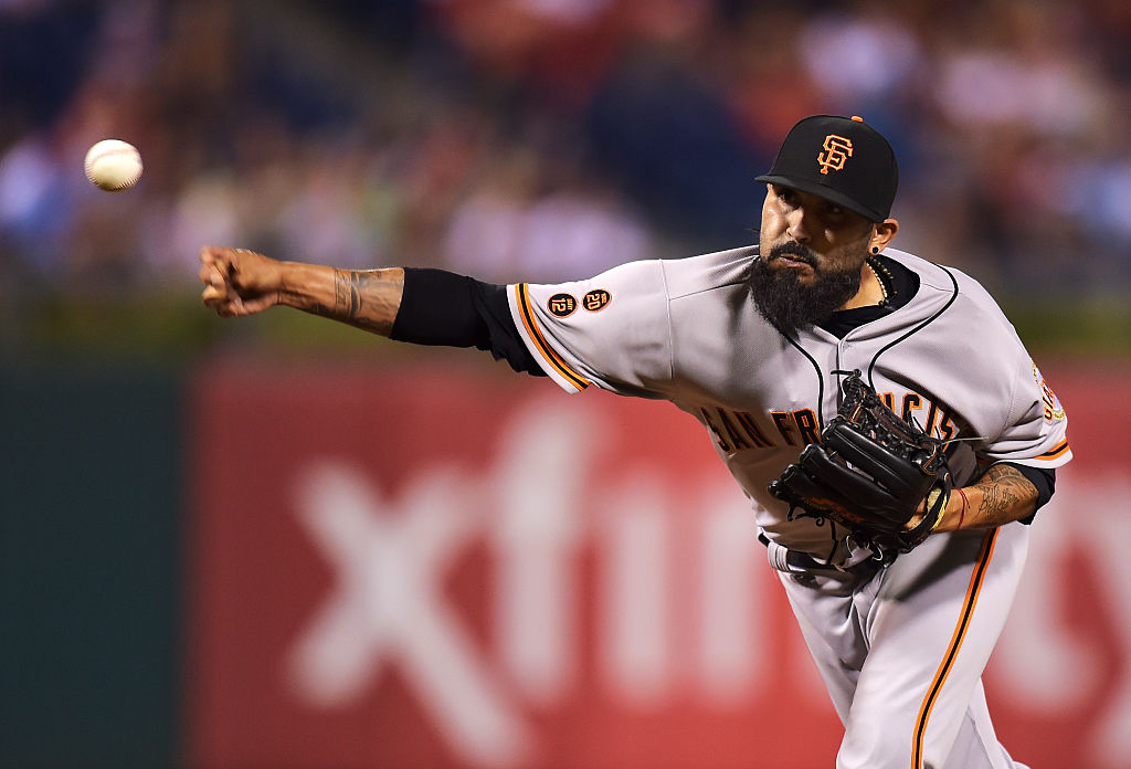 Sergio Romo #54 of the San Francisco Giants delivers a pitch in the eighth inning against the Phila...