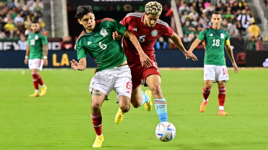 Colombia's midfielder Steven Alzate (R) vies for the ball with Mexico's defender Gerardo Arteaga during the international friendly football match between Mexico and Colombia at Levi's Stadium in Santa Clara, California, on September 27, 2022.